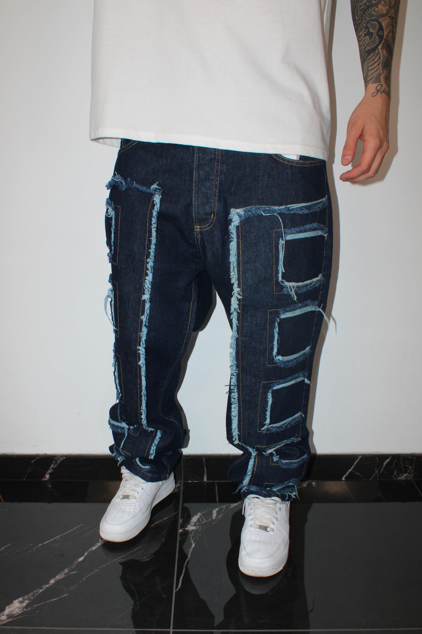 Jeans denim con toppe