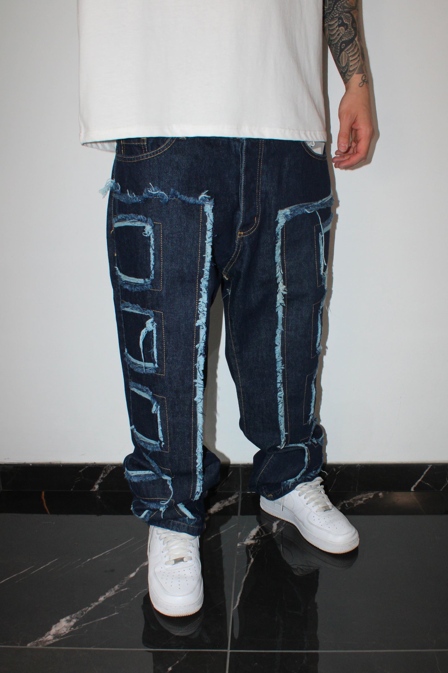 Jeans denim con toppe